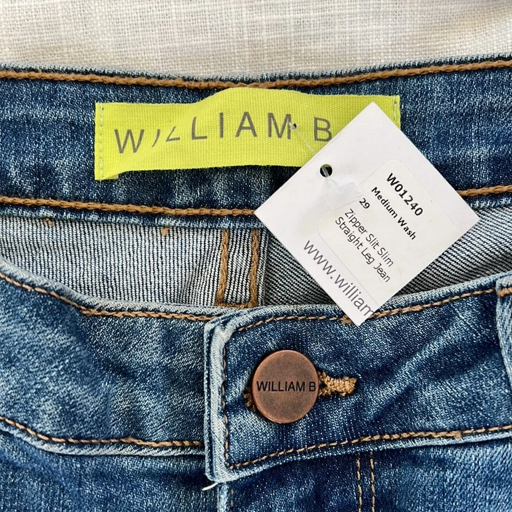 William B size 29 medium wash zipper slit slim straight leg jean. New with tag